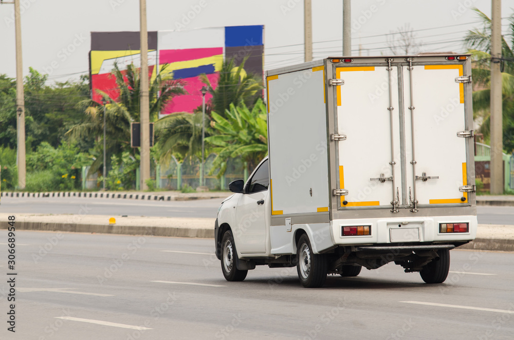 truck running on the road, small truck on the road.