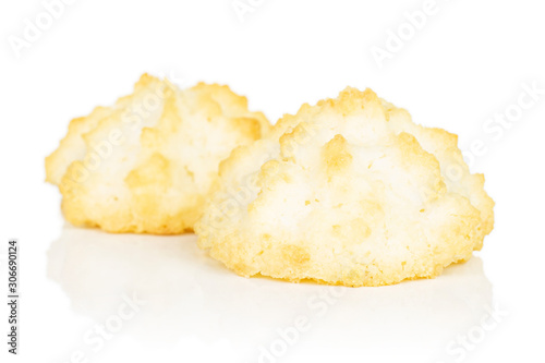 Group of two whole homemade golden coconut biscuit isolated on white background