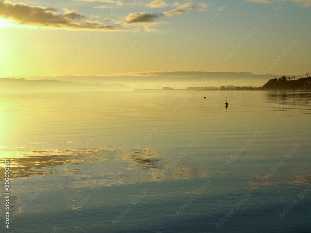 beautiful landscape with morning mist above sea, blurred sea background