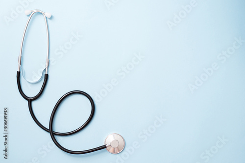 stethoscope medicine tools on blue background, copy space photo