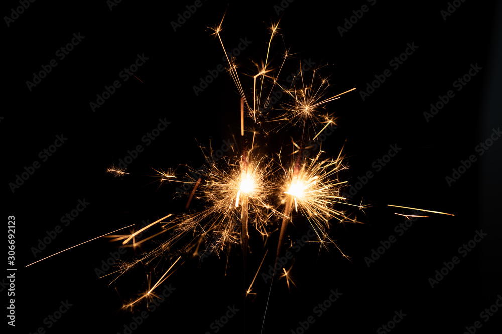 Firework sparkler burning isolated black background, shining fire flame, celebration festival happy holiday new year and merry christmas concept.