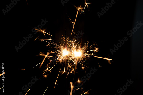 Firework sparkler burning isolated black background  shining fire flame  celebration festival happy holiday new year and merry christmas concept.