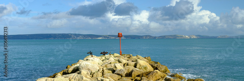 Portland Bill Light house with a stormy sunset photo