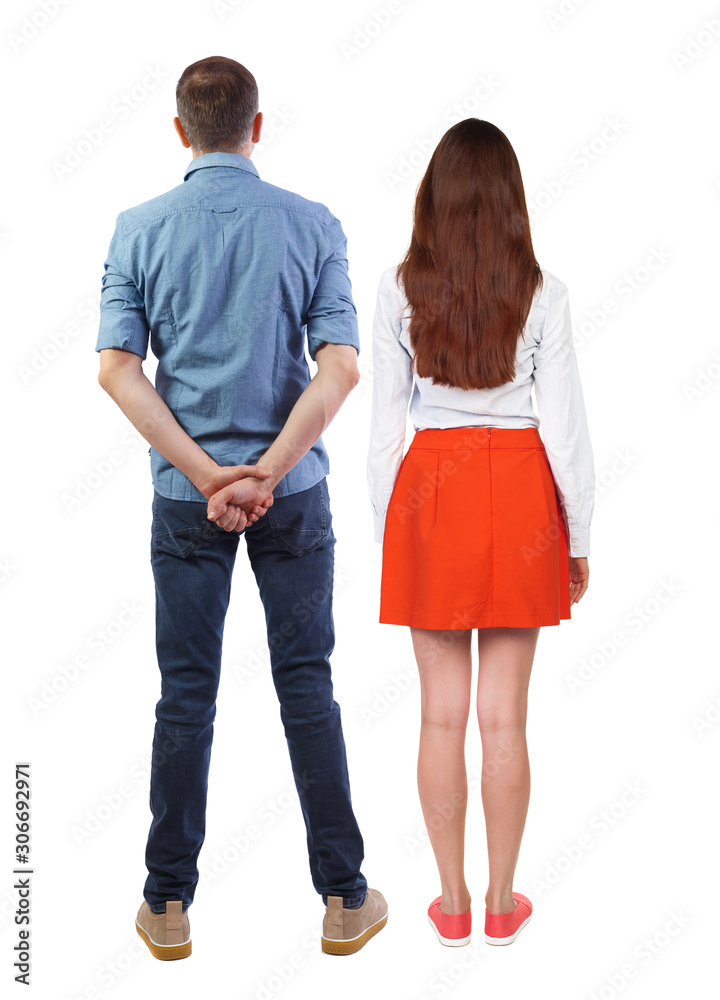 Back view of couple. beautiful friendly girl and guy together. Back view of couple. beautiful friendly girl and guy together.