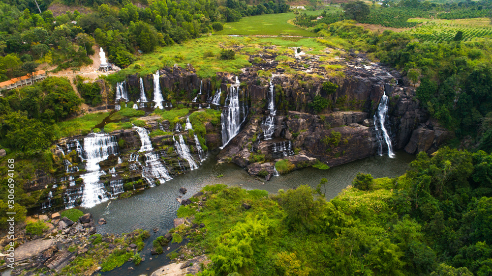 Aerial view for beautiful Pongour waterfall in Vietnam. Amazing vietnamese nature with Buddha on the top of waterfall Aerial view for beautiful Pongour waterfall in Vietnam. Amazing vietnamese nature with Buddha on the top of waterfall