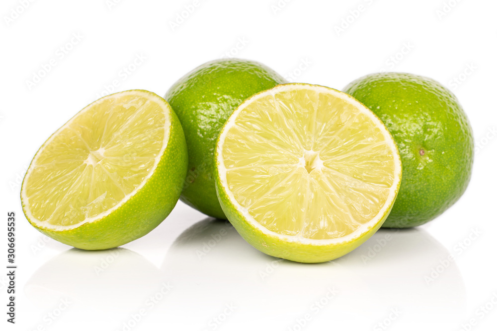 Group of two whole two halves of sour green lime isolated on white background Group of two whole two halves of sour green lime isolated on white background