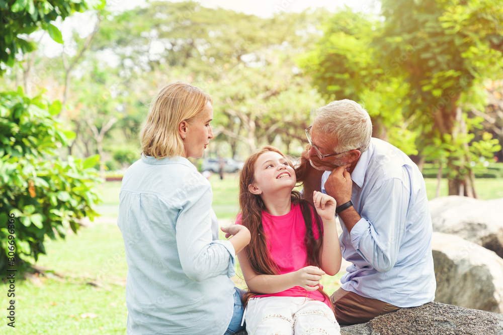 Senior family with daughter playing outdoor Senior family with daughter playing outdoor