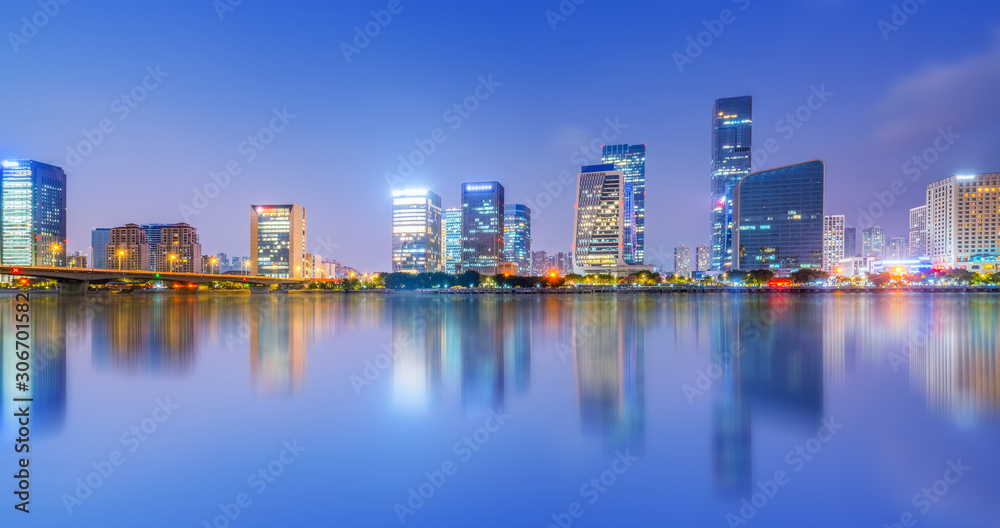 Fototapeta premium Night view of modern office building in Fuzhou Financial District..