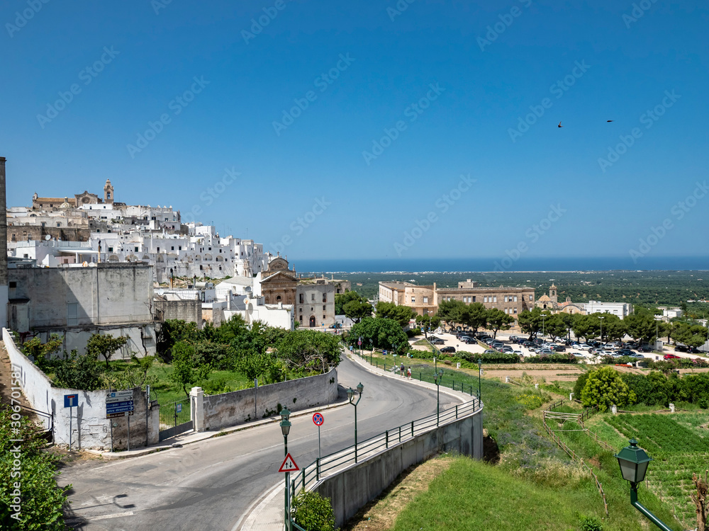 Fototapeta premium the white old town of the mountain village, Ostuni, Apulia, Southern Italy, June 2019