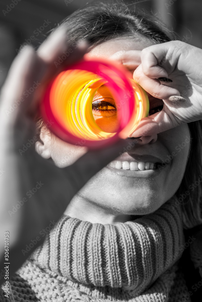 Abstract image of a smile joy girl on a black and white background with color of vision (vision restoration, optimism, ending depression - concept)