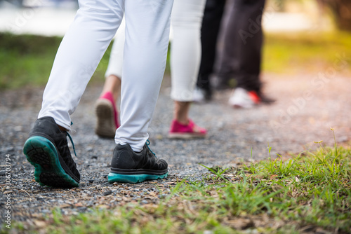 People wear sport shoes walking, running, traveling, hiking or exercise together outdoors workout in the park, close up of feet.