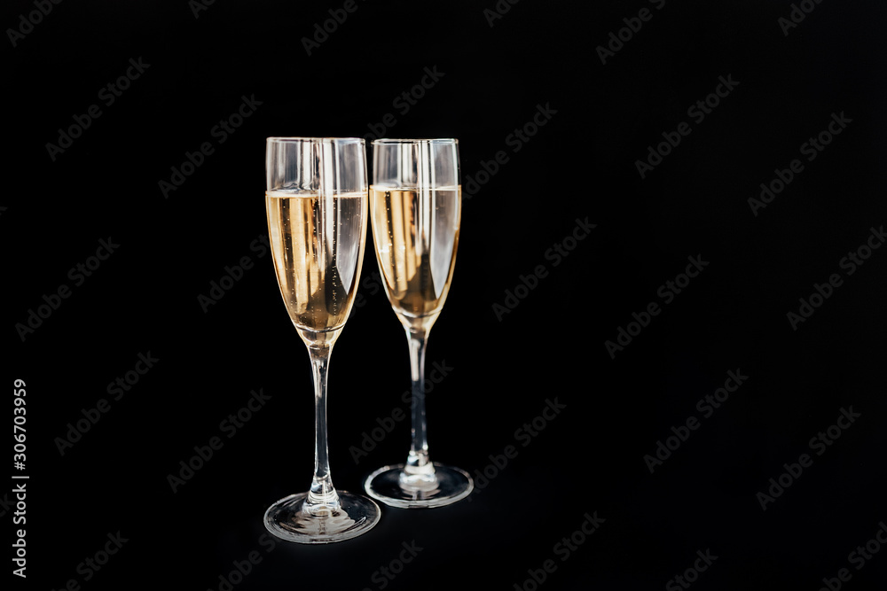 Happy New Year concept, two glasses of champagne on black background. Merry christmas.