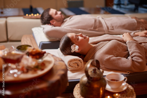 Wallpaper Mural Drinking tea and relaxing in spa salon, lying down on beds and enjoy wearing bathrobe Torontodigital.ca