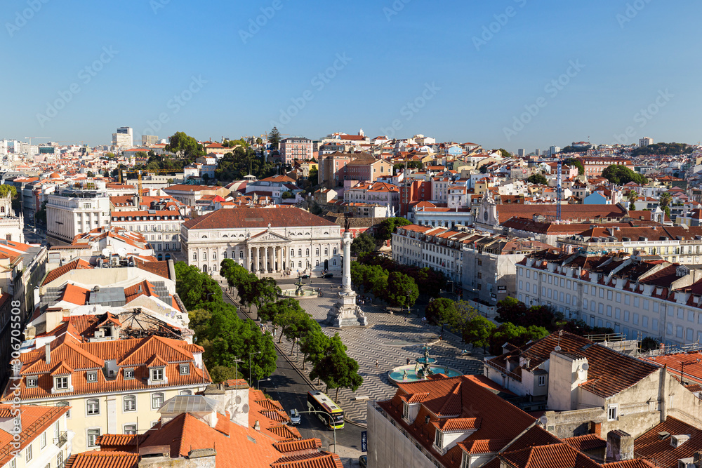 View of the Rossio Square (Praca do Rossio) in the Baixa district and beyond from above in Lisbon, Portugal, on a sunny day.