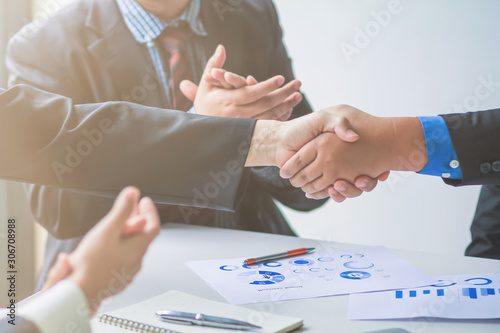 soft Focus,A group of businessmen are handshake together to show the symbol of congratulations that the deal has been completed. photo