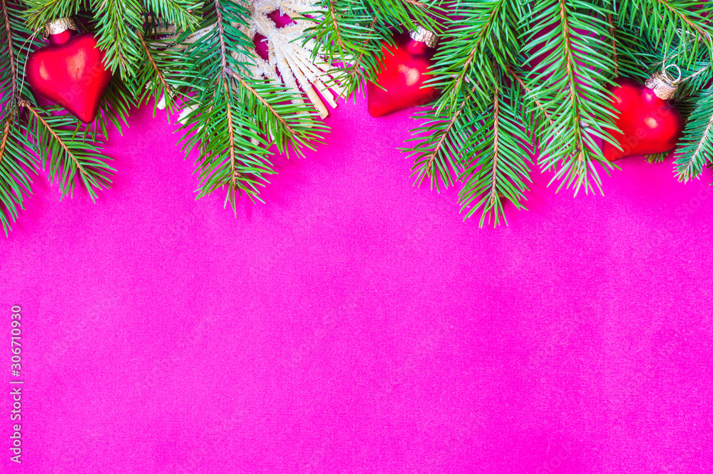 Christmas and New Year theme decorated background, top view, with Christmas tree branches and ornaments Christmas and New Year theme decorated background, top view, with Christmas tree branches and ornaments