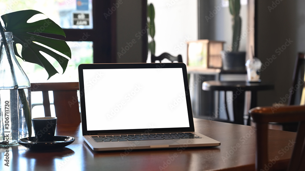 Mockup laptop computer on wooden cafe. Mockup laptop computer on wooden cafe.