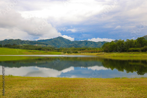 Beautiful landscape mountain and river in park with reflection and blue sky in evening day. Nature concept