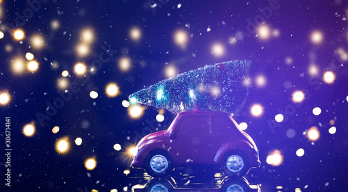 Retro toy car with Christmas tree. Holiday background for greetings.