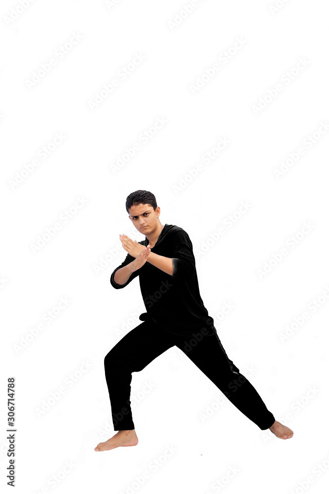 Fulllength shot of aggressive alert male teenager with Asian fight