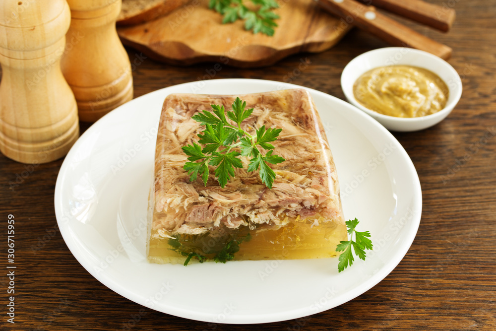 Homemade meat jelly with mustard. Selective focus Homemade meat jelly with mustard. Selective focus