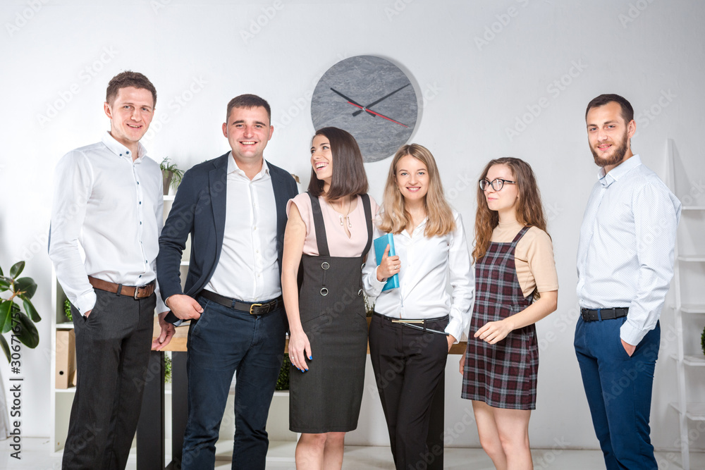 © Elizaveta - Smiling employees standing looking camera making team picture in office together. Business People Team. Successful company with happy workers. People Meeting Communication Corporate Teamwork Concept © Elizaveta - Smiling employees standing looking camera making team picture in office together. Business People Team. Successful company with happy workers. People Meeting Communication Corporate Teamwork Concept