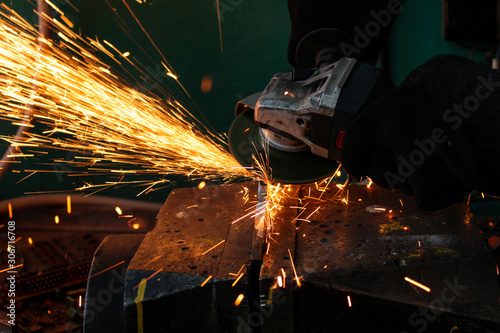 work as a grinder, metal cutting, sparks from metal cutting