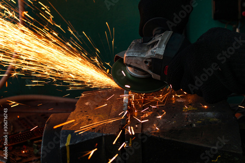 work as a grinder, metal cutting, sparks from metal cutting
