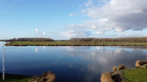 Drone footage, a right turn over the tidal river Het Spui in Holland with calm and clear weather. photo