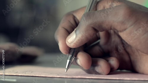 Signing an envelope that will be mailed to a job opportunity photo