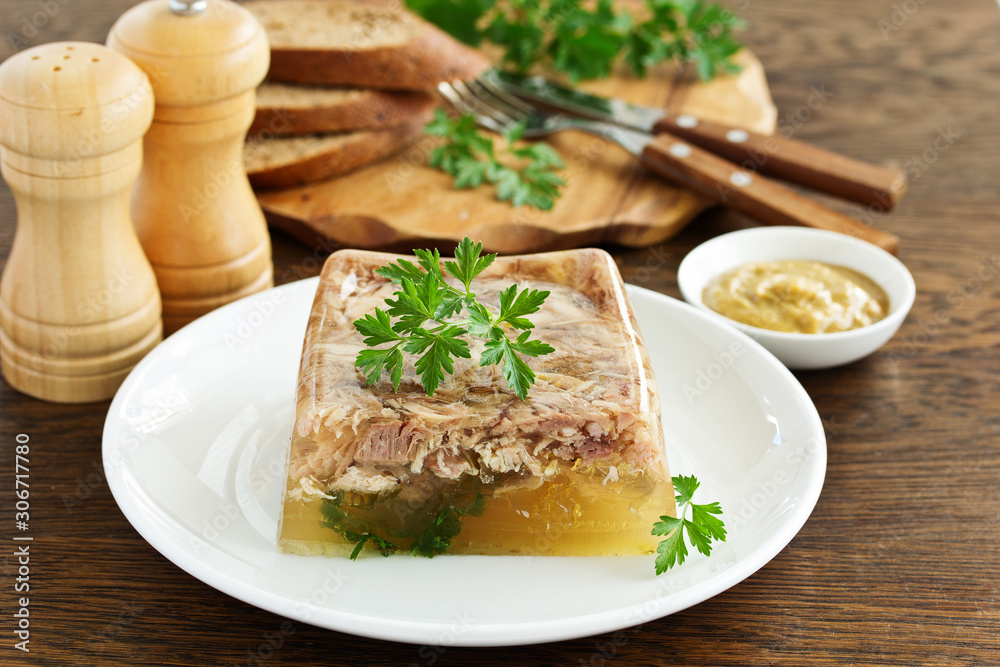Homemade meat jelly with mustard. Selective focus Homemade meat jelly with mustard. Selective focus