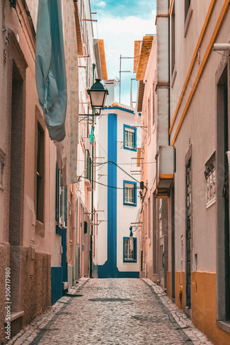 Narrow portugal street with warm tones 2