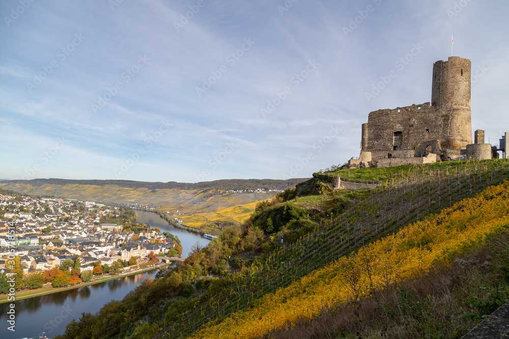 View at Landshut castle in Bernkastel-Kues on the river Moselle in autumn with multi colored vineyards