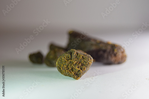 A medical marijuana plant extract. Cannabis flower extract. Weed concentrate. THC concentrate. Cannabis wax. Bubble hash