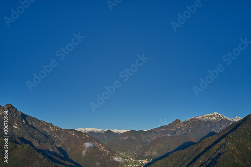 Panoramic view of the mountains in the background clear blue sky. Snow on the top of the mountain.