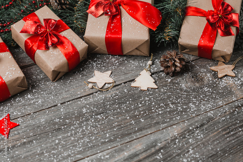 Christmas Presents On Snow Covered Table Surface photo