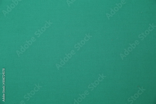 green fabric background with copy space for your text. Turquoise color. seamless pattern. Color empty background.