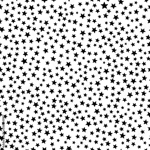 Busy all over seamless repeat pattern with tiny small ditsy black stars tossed on a white background
