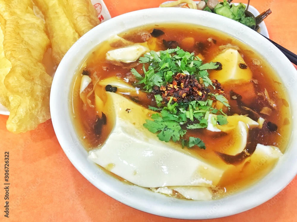 Tofu and Fried dough sticks on the table. Tofu and Fried dough sticks on the table.