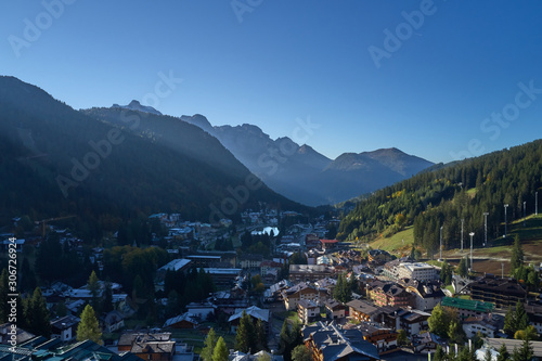 Aerial view of ski resort Madonna di Campiglio, italy. Morning is the autumn season. In the background a clear blue sky