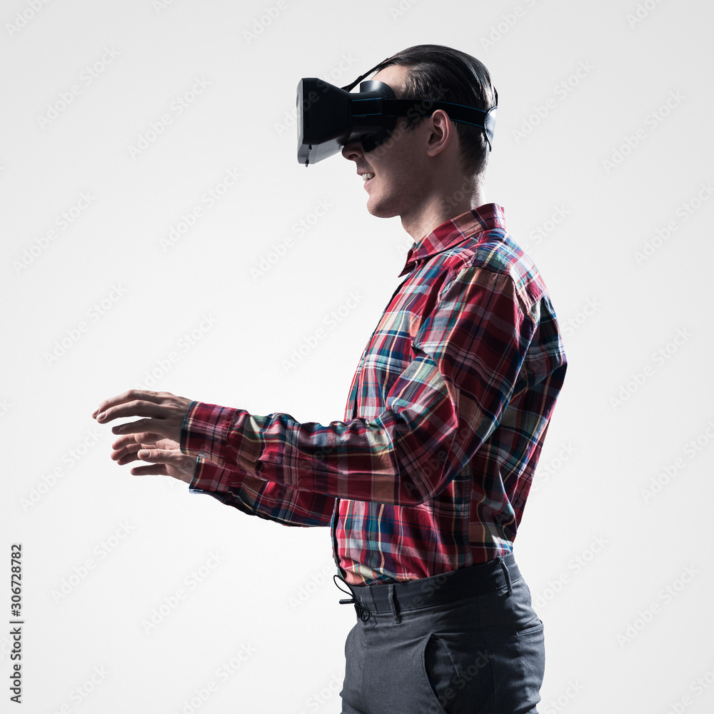 Guy in mask experiencing virtual reality as new entertainment device Guy in mask experiencing virtual reality as new entertainment device