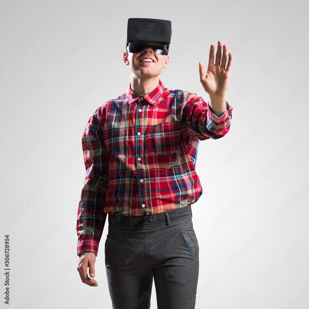 Guy in mask experiencing virtual reality as new entertainment device Guy in mask experiencing virtual reality as new entertainment device