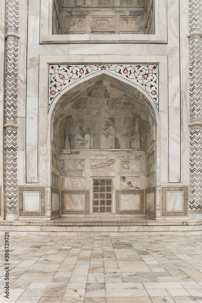 Decorated marble arch of the Taj Mahal monument in Agra, India