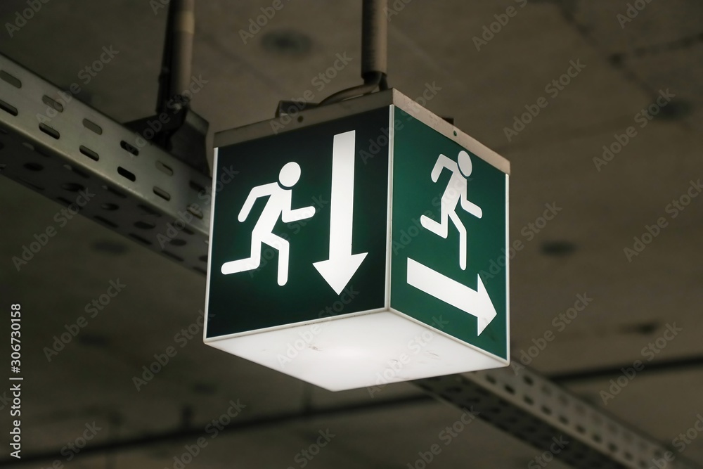 Emergency exit sign glowing in the dark Emergency exit sign glowing in the dark