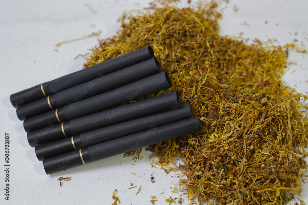 cigarette filters Empty cigarette paper top view Several black and