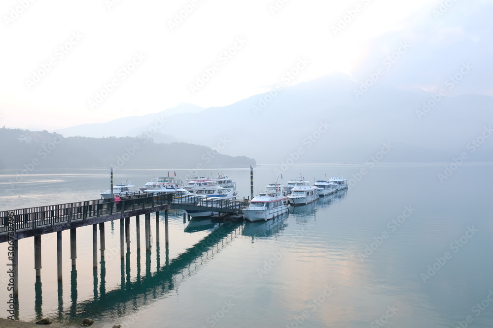 Boat on the lake ,Asia culture - Beautiful landscape of lake sunrise sky in Sun Moon Lake , in Taiwan, Asia. the famous travel attractions in Nantou ,Taiwan. Scenery of Sun Moon Lake Boat on the lake ,Asia culture - Beautiful landscape of lake sunrise sky in Sun Moon Lake , in Taiwan, Asia. the famous travel attractions in Nantou ,Taiwan. Scenery of Sun Moon Lake