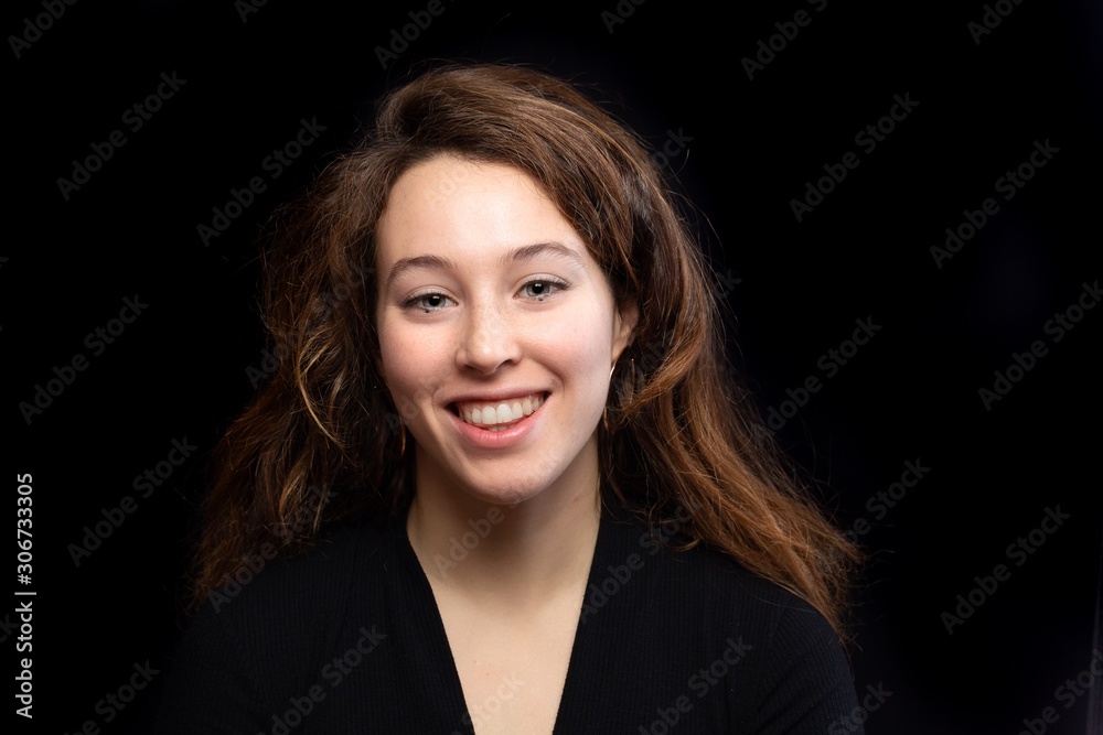 Close-up of a smiling brown-haired girl with gray eyes Close-up of a smiling brown-haired girl with gray eyes