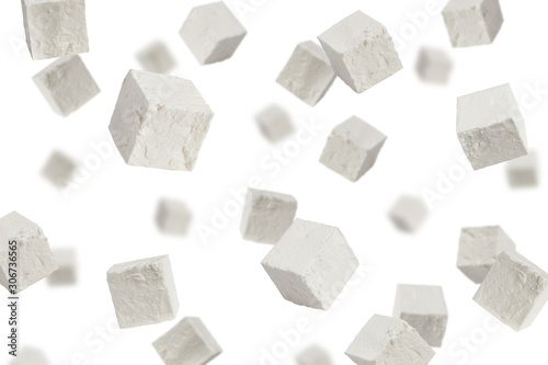 Falling Feta, Greek cheese cubes, isolated on white background, selective focus