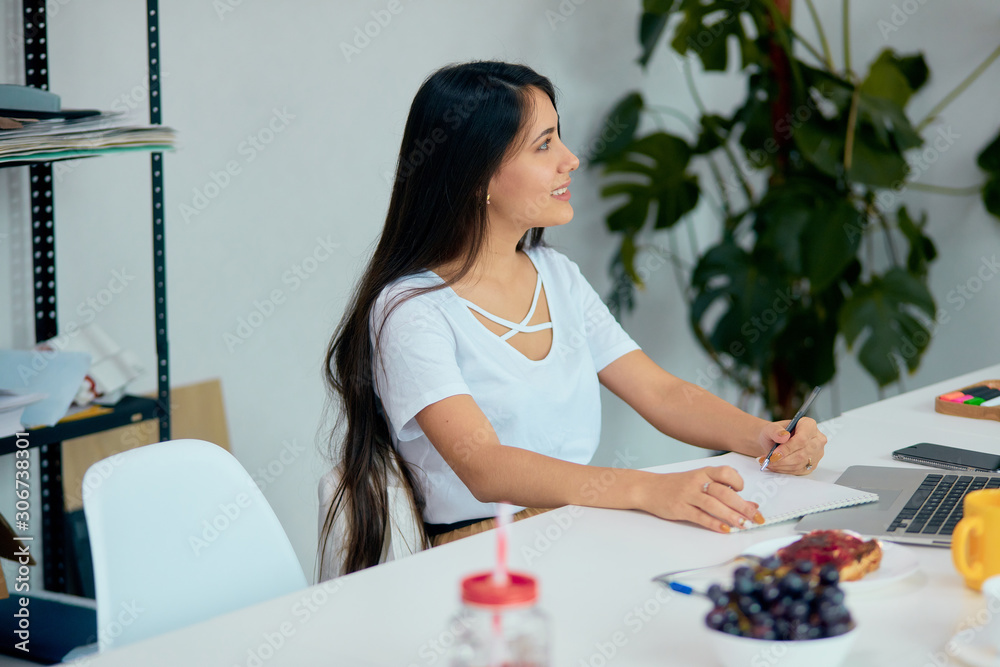nice young business lady with partners in modern light office, smiling, sitting at desk, develop new project, start up, discuss and listen nice young business lady with partners in modern light office, smiling, sitting at desk, develop new project, start up, discuss and listen