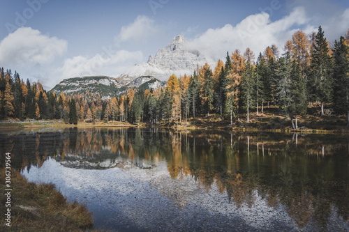 Fototapeta Naklejka Na Ścianę i Meble -  Moutnain above forest, autumn at the lake in Dolomites Italy